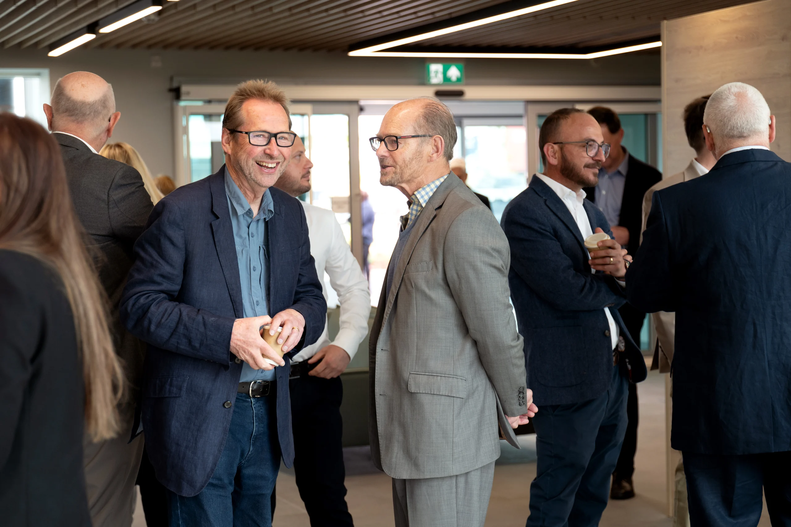 Business professionals networking at a community event